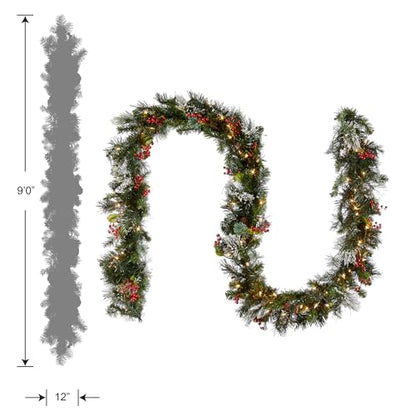 National Tree Company Pre-Lit Artificial Christmas Garland, Green, Wintry Pine, White Lights, Decorated with Pine Cones, Berry Clusters, Plug In, Christmas Collection, 9 Feet
